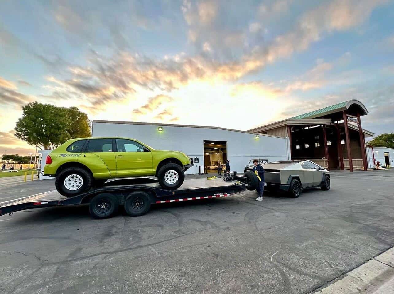 ROADMOTO flatbed car hauler trailer transporting a vehicle at sunset in California